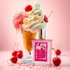 Shimmer Fragrance Mist bottle labeled ‘Glampton Crushed Cherry’ next to a colourful ice cream cone on a pink background.