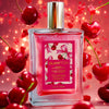 Shimmer Fragrance Mist bottle labeled ‘Glampton Crushed Cherry’ surrounded by cherries on a red background.