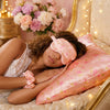 Lifestyle image featuring Glampton’s floral vintage-print satin sleep set, including satin pillowcases, a matching eye mask, and satin scrunchies, styled in a cozy beautiful bedroom setting.