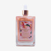 Glampton Sweet Peach Shimmering Body Oil bottle with a dropper cap shown on a light grey background.
