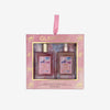 Glampton Sweet Sugar 2-piece gift set featuring a Shimmer Fragrance Mist and a Shimmering Body Oil in a pink box with gold bow accents and a ribbon handle.